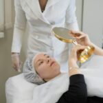 Client examines her skin post-treatment, the reflection of satisfaction. A personalized skincare