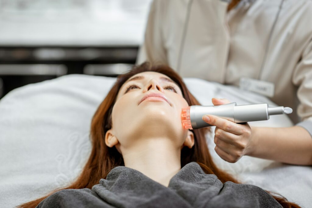 Woman during the facial treatment at the beauty salon