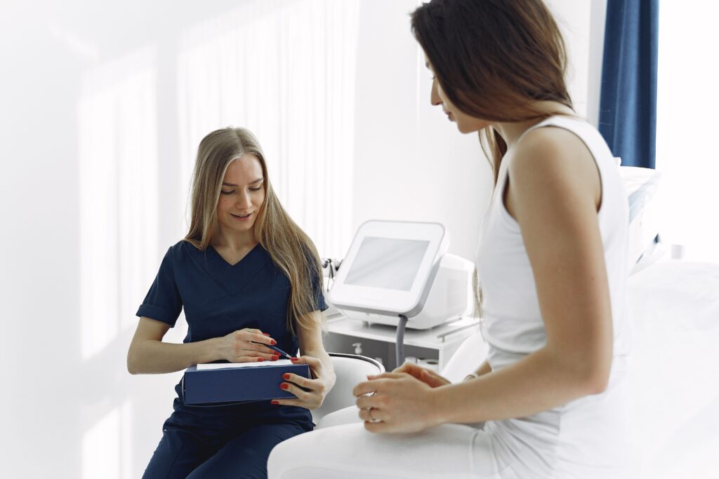 Aesthetic specialist consulting with a patient to discuss personalized cosmetic treatment options.