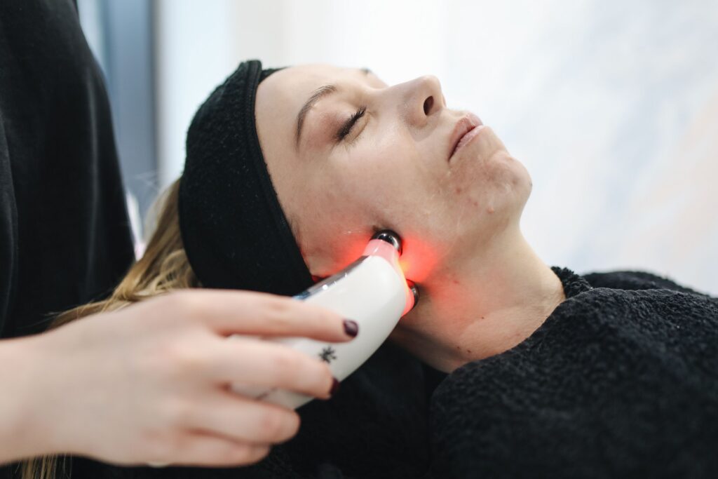 Non-invasive radiofrequency facial treatment being performed to tighten skin and improve facial contours.